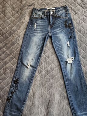 KanCan Distressed Blue Skinny Jeans with Black Floral Appliqué